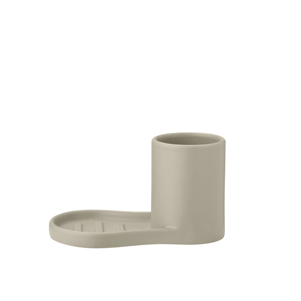 Modern beige ceramic cup with an attached saucer for sleek tableware design.
