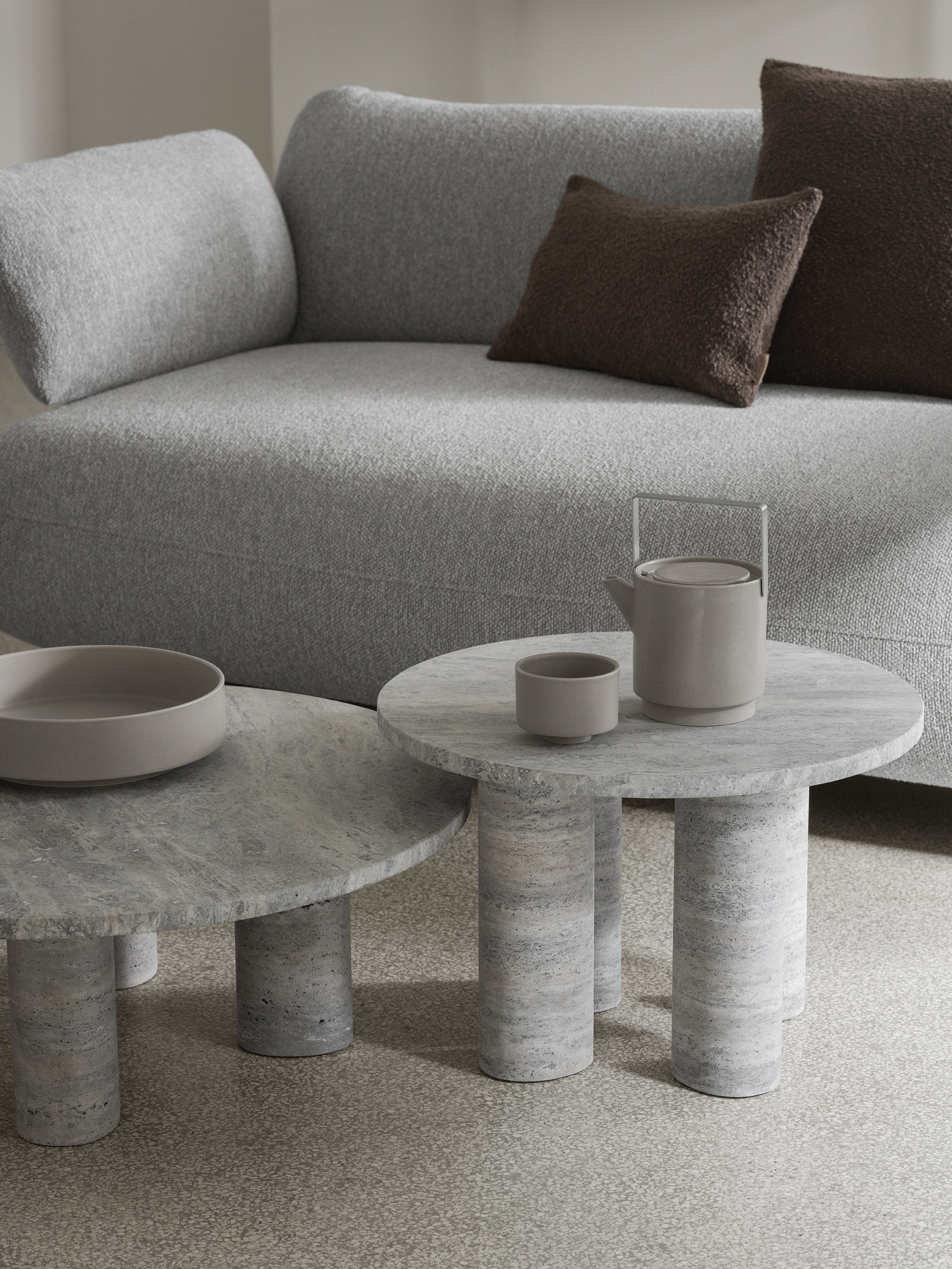 modern travertine tables with stylish dish on it