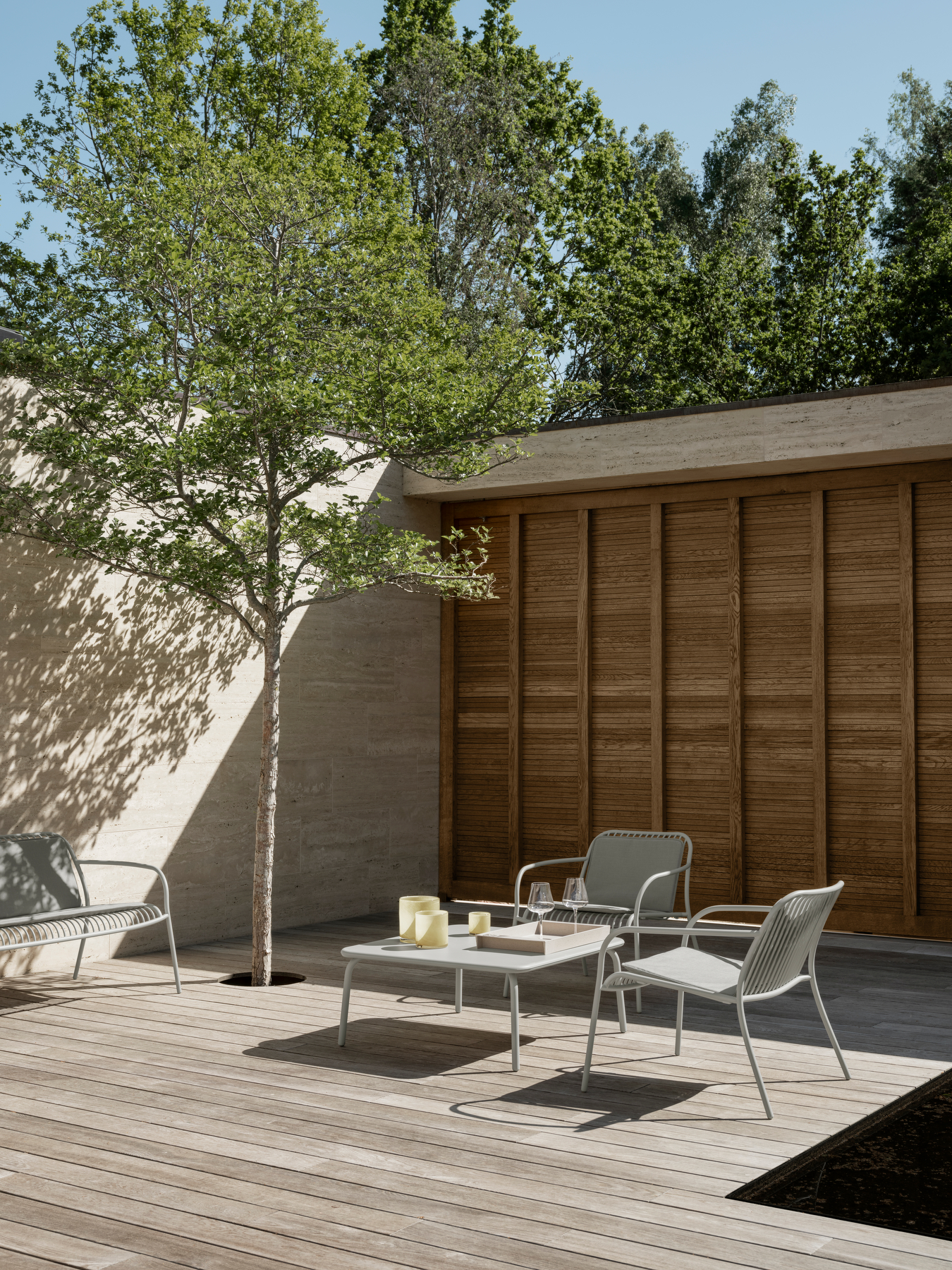 Lounge Furniture by blomus standing outside on a wooden floor