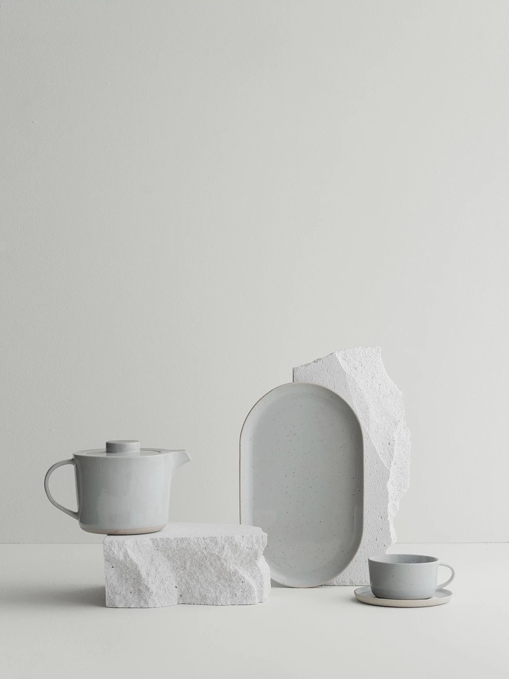 Tea pot, dishes & coffee mugs with salt and pepper shaker
