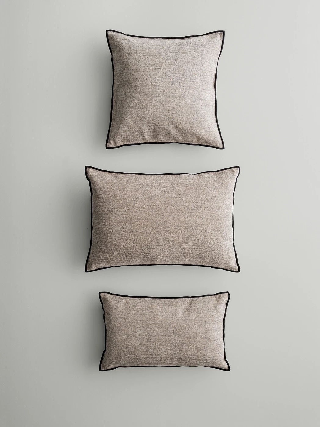 3 different pillows on floor